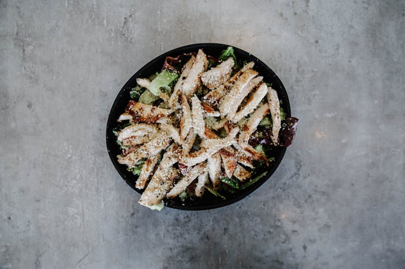Grilled chicken salad Dewey's pizza